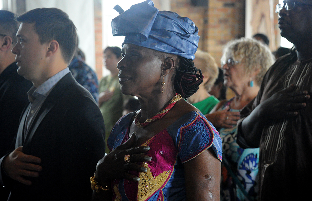 Guinea native Kadiatou Conte-Forte participates in the Pledge of Allegiance during the Naturalization Ceremony at the Pump House in Munhall on Sept. 7, 2016. (Lake Fong/Post-Gazette) Copyright Pittsburgh Post-Gazette, 2017, all rights reserved. Reprinted with permission. 