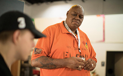 VonZell Wade (right), cofounder of Lost Dreams Awakening, speaks with Ethan Faybik. Wade uses his own experience with substance abuse to help others in recovery. Faybik is in recovery and says his favorite thing about not using is not having to lie all the time.