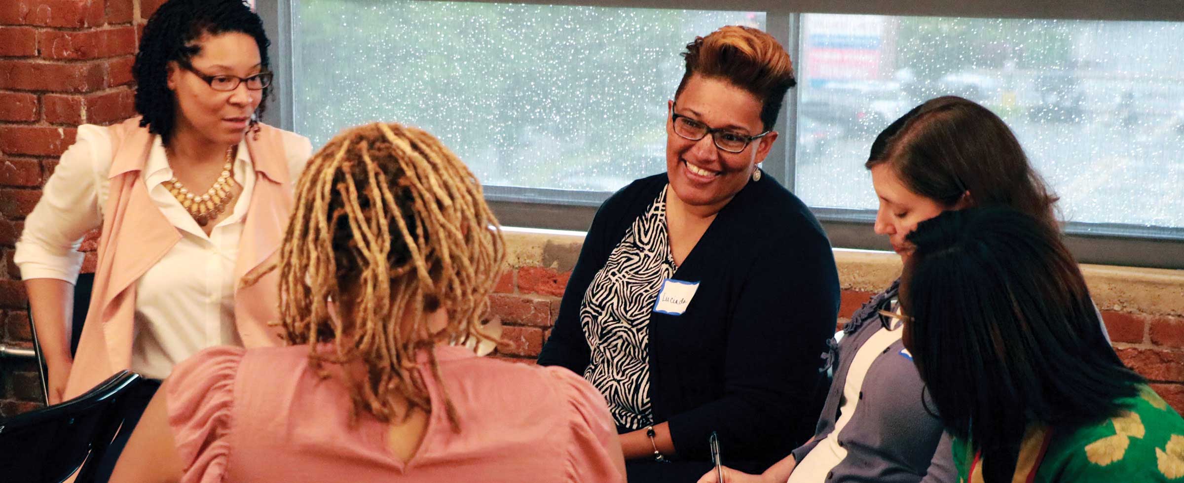The Pittsburgh Foundation’s Michelle McMurray (far left) participates in a group strategy discussion with Lucinda Wade from Coraopolis Youth Creations, Aviva Lubowsky from the Hebrew Free Loan Association, Tamara Whiting from SisterFriend, and Tiffany Huff-Strothers, board member of Coraopolis Youth Creations.