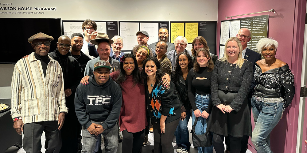 Group photo taken at program and collaboration of Italian Jitney with director/producer Renzo Carbonera, Italian actor Alessandra Arcangeli, August Wilson House Chief Executive Denise Turner, Board members, Director of Programming and August Wilson House, Founder Paul Ellis, University of Pittsburgh Library System staff, University of Pittsburgh Honors College members, actor Carter Redwood and Reginald Howze.