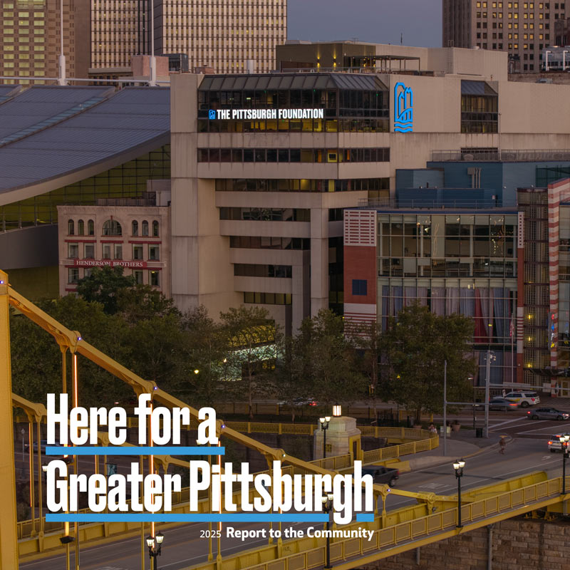 Pittsburgh skyline with Pittsburgh Foundation building in background and yellow bridge in foreground.
