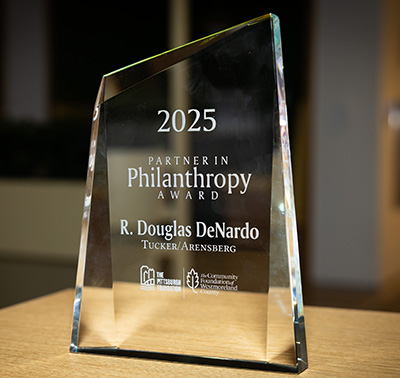 Glass award for 2025 Partner in Philanthropy for Doug DeNardo.