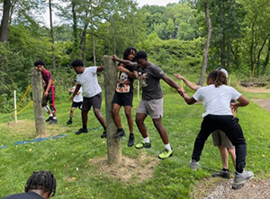 1Nation Mentoring, a grantee organization, offers in-school and out-of-school programming for African American youth. At left, a Slippery Rock University ropes course builds leadership, teamwork and confidence in participants. (Photo credit: Nate Smallwood).