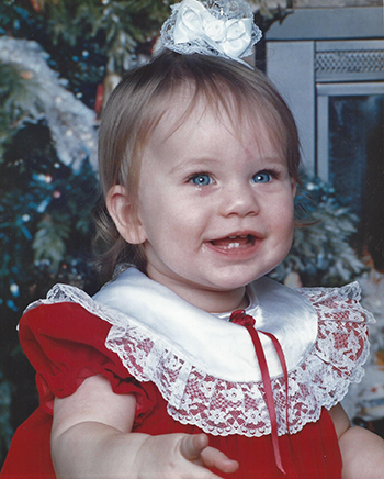 Smiling baby with blue eyes, Sarah Hrivnak.