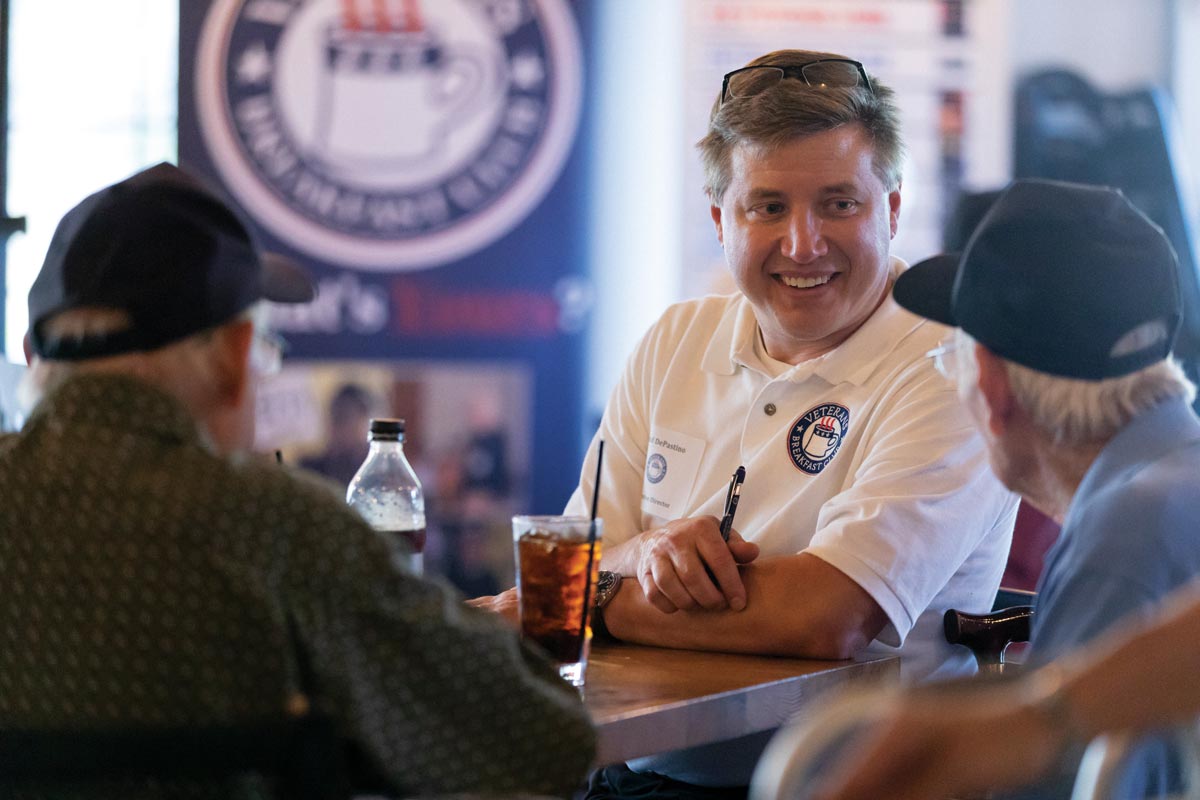 Founder of Veterans Breakfast Club, Todd DePastino, speaks with vets at one of the organization’s monthly events. VBC invites veterans to tell their stories to ensure their history will not be forgotten and aims to raise awareness of the veteran experience.