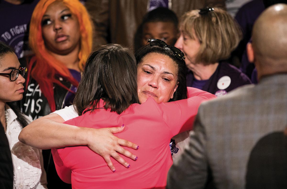 Michelle Kenney, Antwon Rose’s mother, is embraced at an April 30 rally inside the Pennsylvania State Capitol building in Harrisburg. Kenney was joined by 400 activists advocating for changes to the state’s Use of Force law. The movement was sparked by the June 19, 2018 shooting death of Rose by police and the acquittal of the officer who killed him.