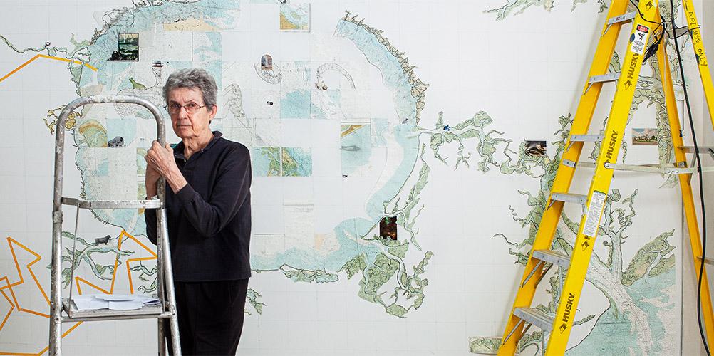 Visual Artist Aldwyth, a 2019 Eben Demarest Fund awardee, stands with her painting, titled “A Foot, a Fathom, a Furlong.” in progress at Jepson Telfair, Savannah GA, 2010. Photo by Jerry Siegel.