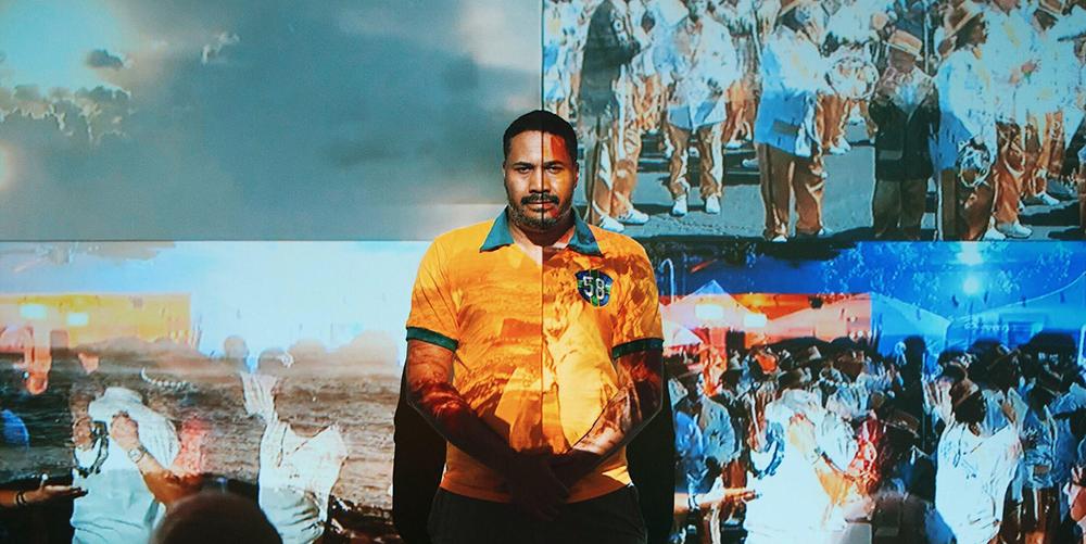 Chris Ivey, a 2021 Exposure Artist Fellowship awardee, preparing for the opening of his "We Are Here" video installation as part of the ArtUp exhibition at the Mattress Factory in May 2018. Image by sarah huny young.
