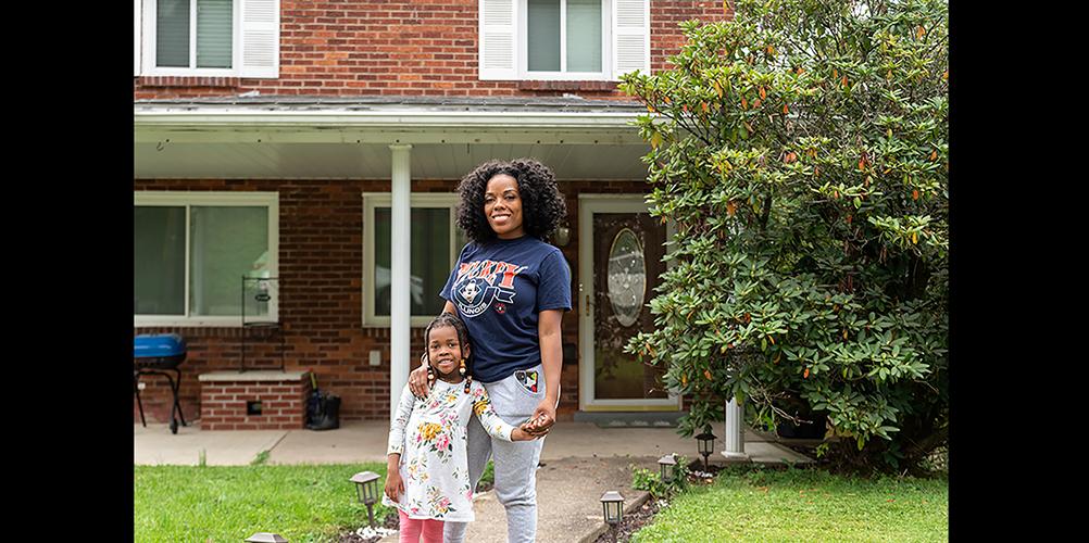 Destiné Askew and her daughter Chloè Moye pose in front of their home. Through services offered by Willisae's Agency for Vision & Empowerment, Destiné was able to purchase her house. Willisae's Agency for Vision & Empowerment also partners with landlords and property management companies to assist individuals facing eviction.
