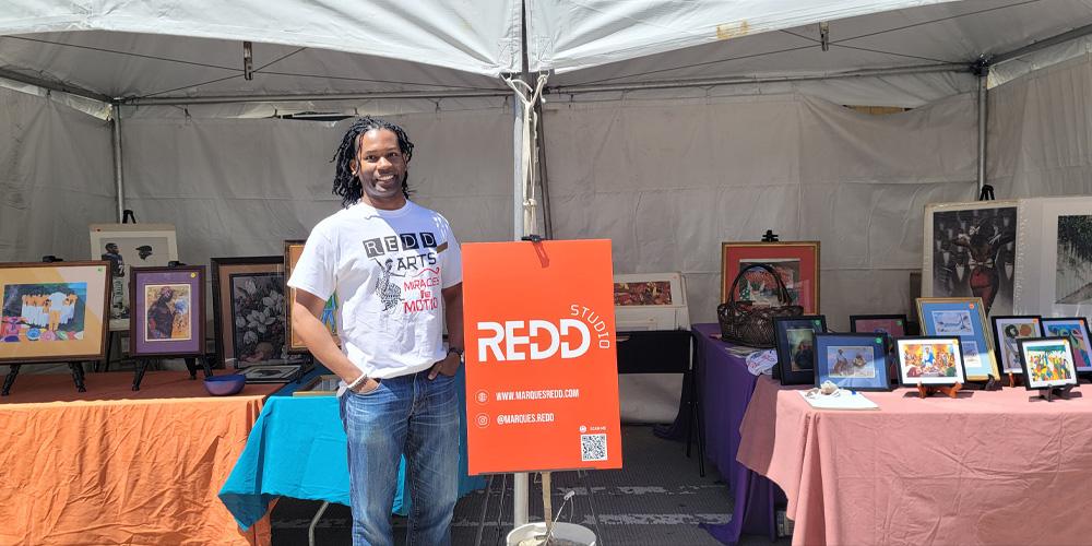 Marques Redd presenting the Redd Family Black Art Collection. Image credit: Isabelle Analo.
