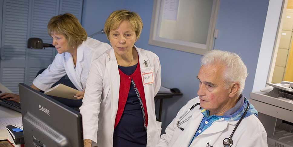 A $9,000 grant from the Community Foundation of Westmoreland County enabled Majesty Health Care Clinic, an all-volunteer organization that recently opened in Greensburg, to invest in new computers and a fluid database. Here,  Dr. Larry Lyons and Ellie Yearsley, RN, discuss treatment options.