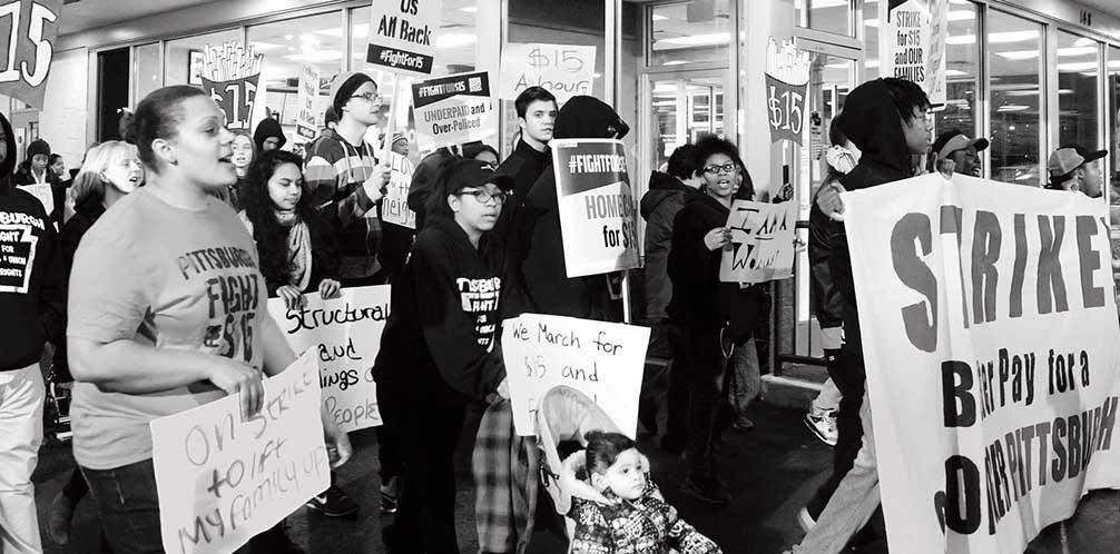 Workers stage a protest to demand a $15-an-hour minimum wage outside the McDonald’s restaurant on Penn Circle in East Liberty in November 2016. PHOTO BY DARRELL SAPP/ POST-GAZETTE.