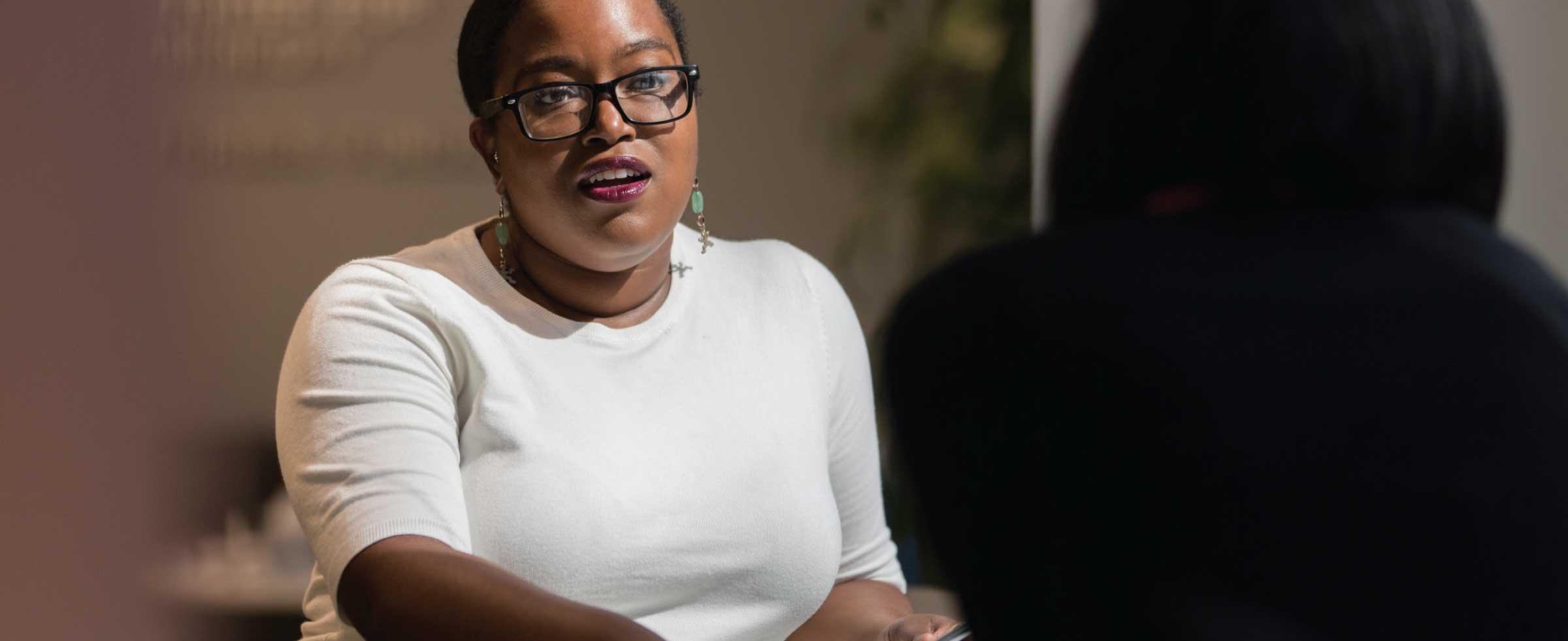 Donor services officer Mahogany Thaxton talks with a Foundation donor. Mahogany joined the staff in February 2017.