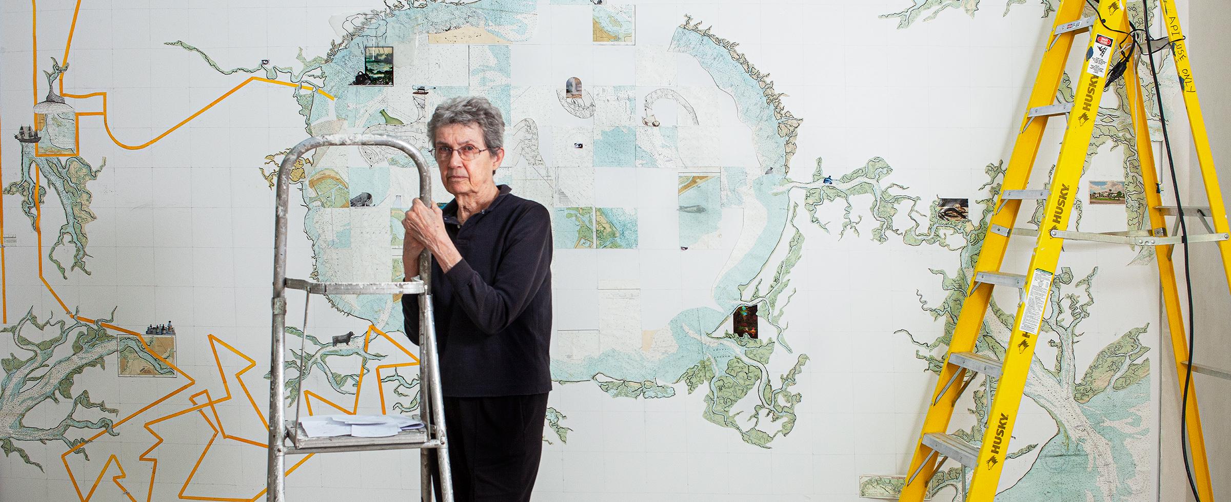 Visual Artist Aldwyth, a 2019 Eben Demarest Fund awardee, stands with her painting, titled “A Foot, a Fathom, a Furlong.” in progress at Jepson Telfair, Savannah GA, 2010. Photo by Jerry Siegel.